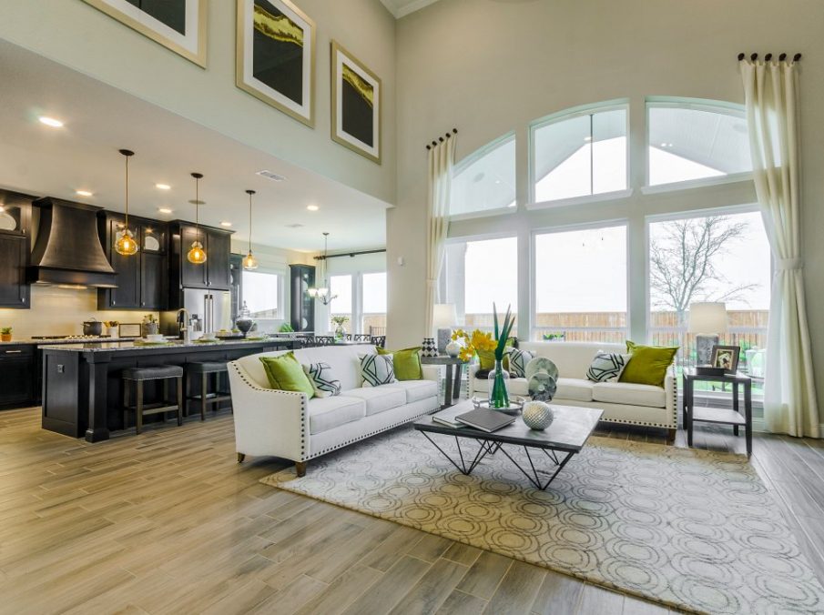 Landon Homes new home builder 432 Carrington Family Room with white couches looking into the kitchen