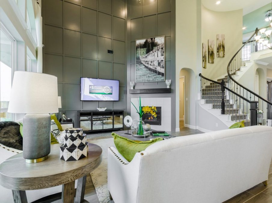 Landon Homes new home builder 432 Carrington Family Room grey textured tv wall and white stone fireplace