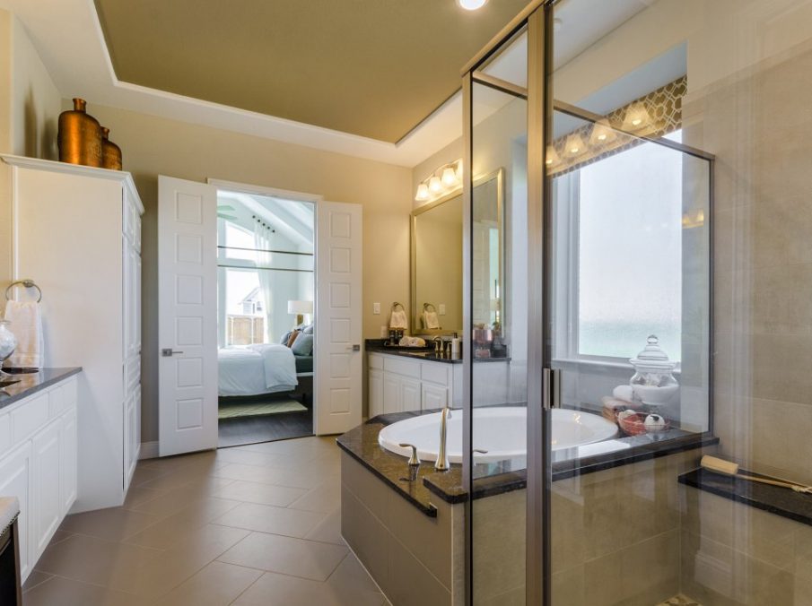 Landon Homes new home builder 432 Carrington Master Bath tile flooring and tan painted cabinets