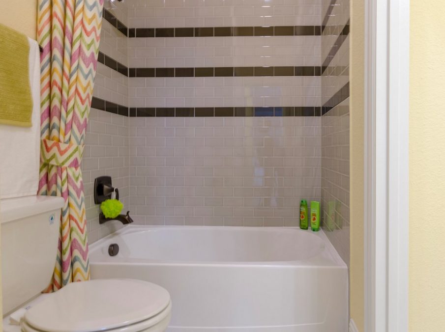 Landon Homes new home builder 432 Carrington Kids Bathroom tub and shower combo with white tiles