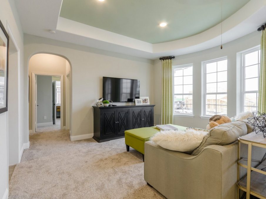 Landon Homes new home builder 432 Carrington Gameroom with tan couch and carpet