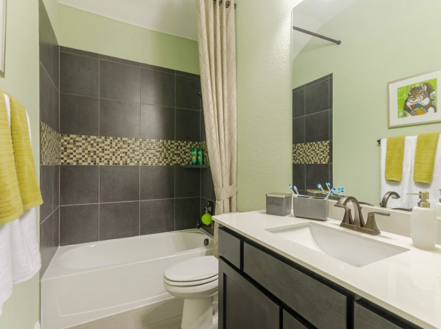 Landon Homes new home builder 432 Carrington Bathroom with green walls and grey shower tiling
